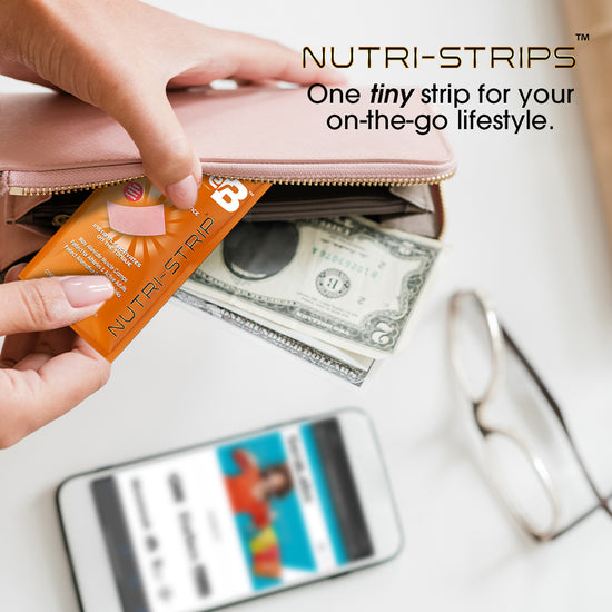 Person putting RecoverB Nutri-Strip into their wallet