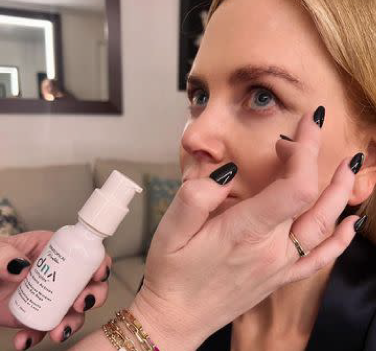 Nicole Kidman having DNA applied to her under eye area before an event